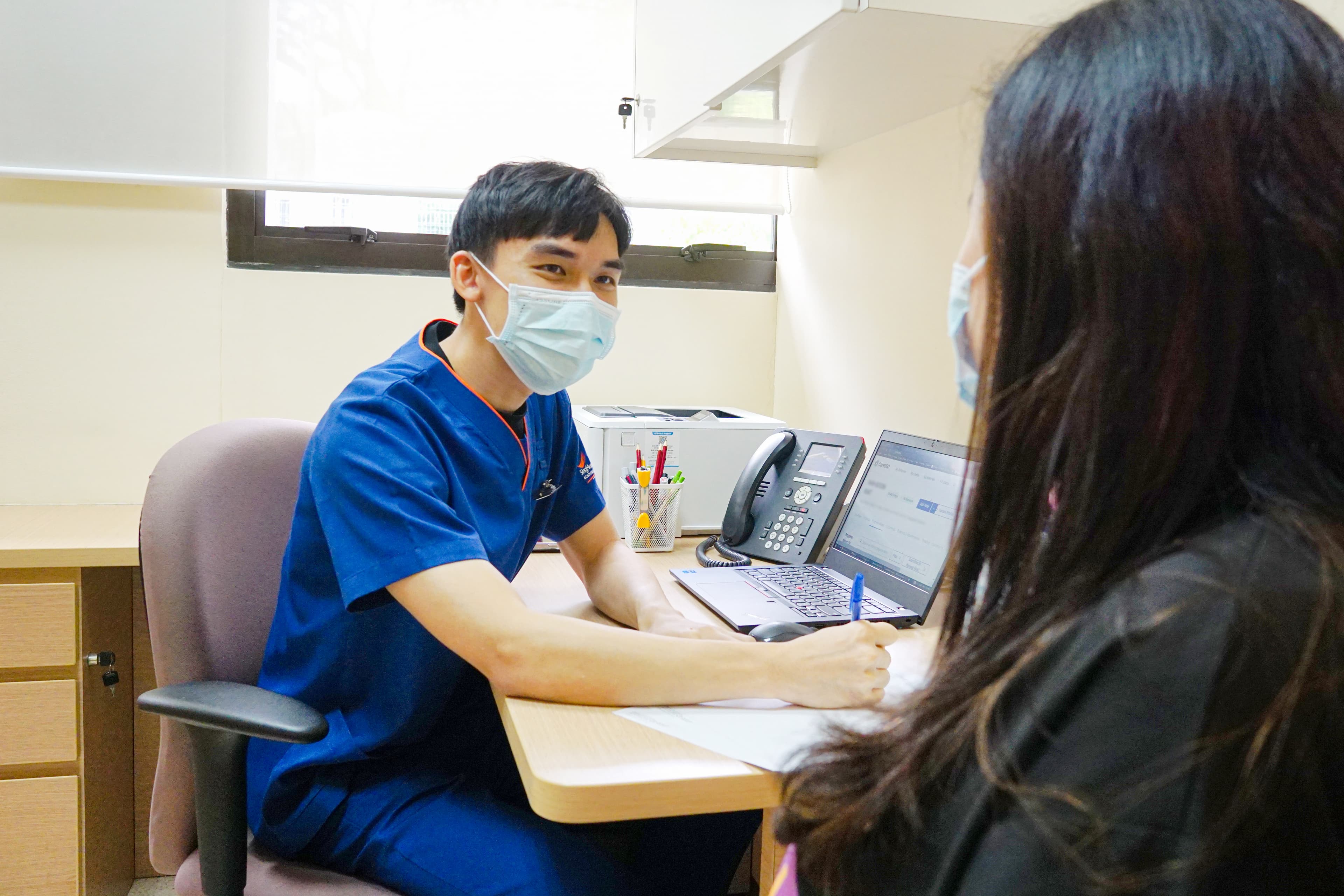 A social worker taking care of a patient