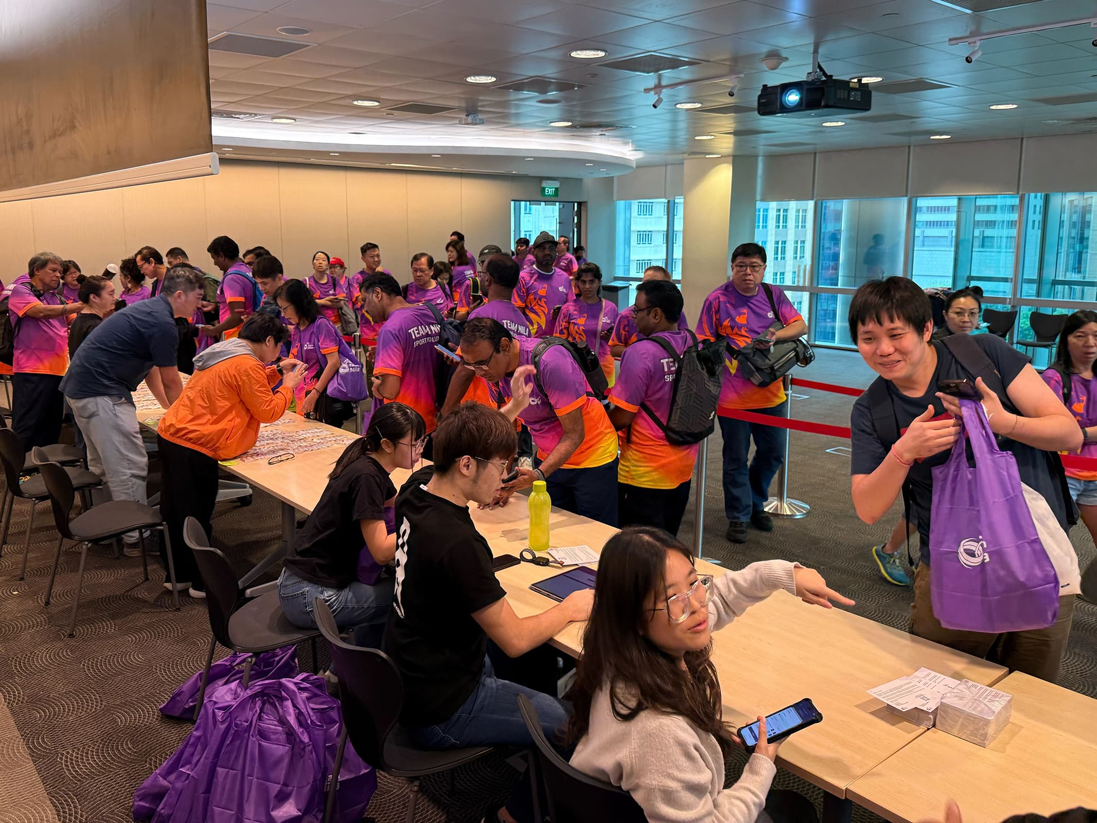 Volunteers distributing items to recipients using DistributeSG